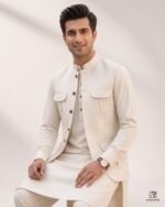 Cream signature three-piece suit seated view – Rumaan Robe